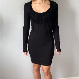 Black long sleeve dress with tassels